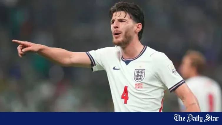 Player in England kit directing teammates during match