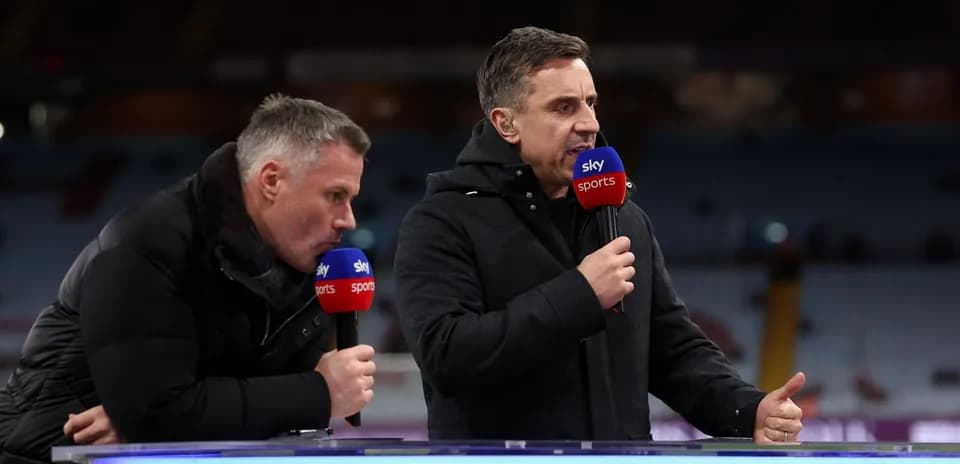 Two presenters discussing sports on broadcast set