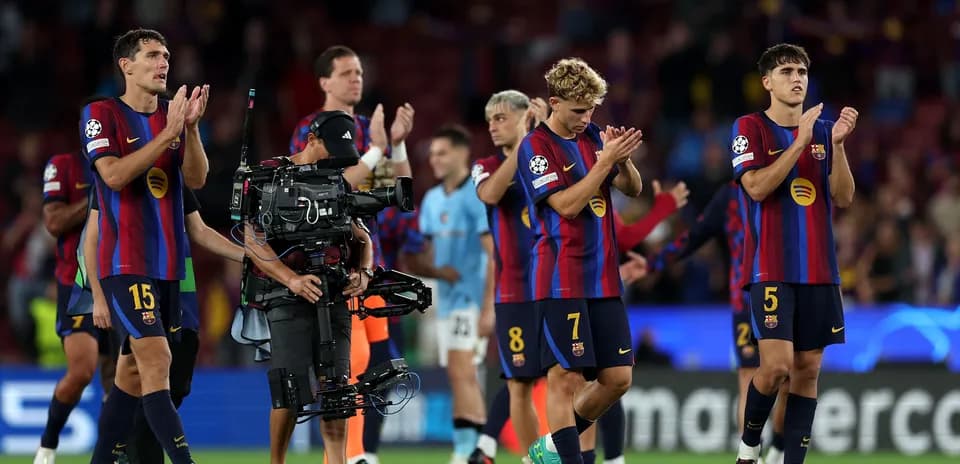 Barcelona players applauding fans after a match