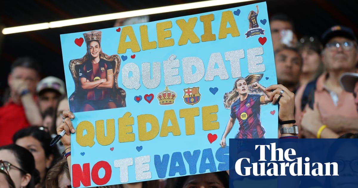 Fan holding sign supporting player during match