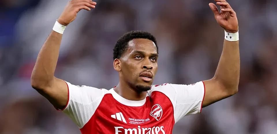 Arsenal player raising hands during match