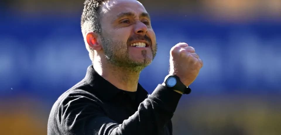 Coach celebrating passionately during a match