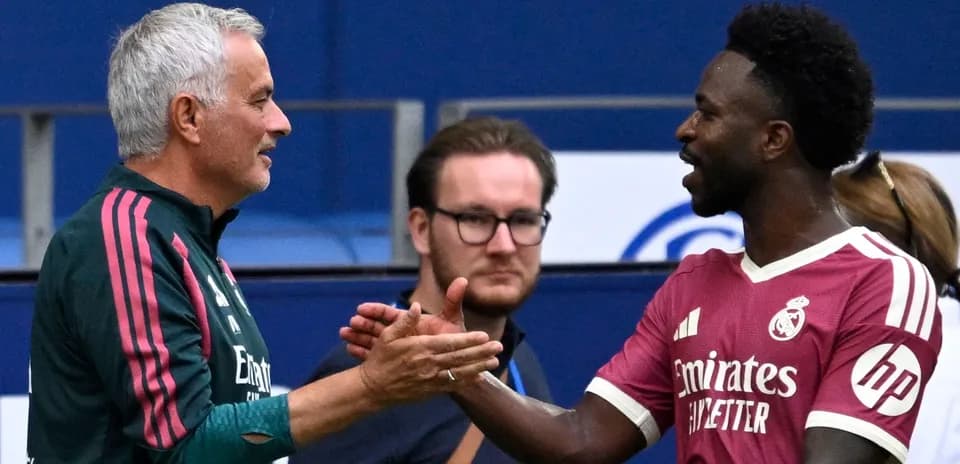 Two men shaking hands on the field