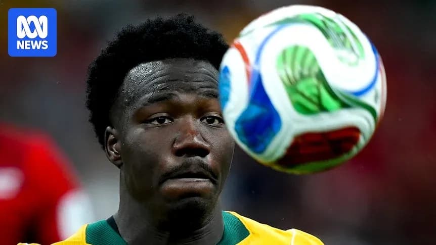 Player watching a soccer ball in mid-air