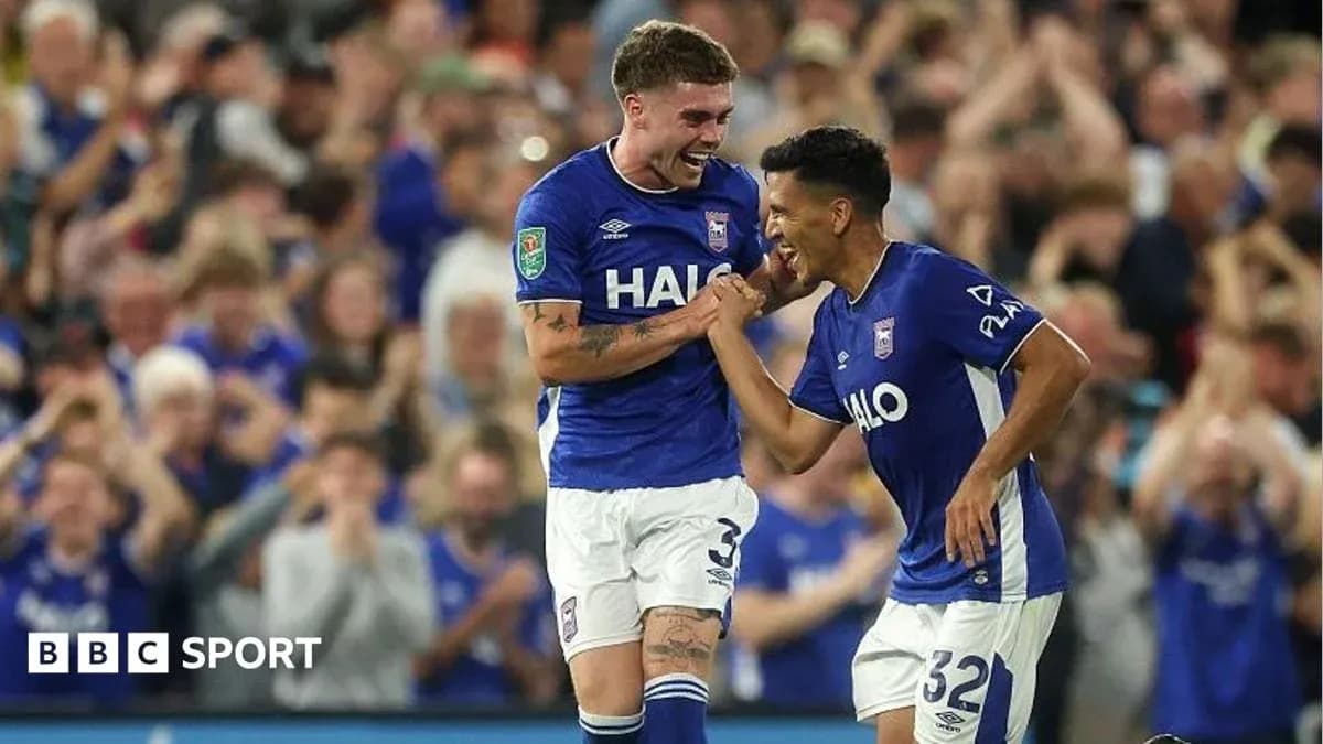 Two Ipswich Town players celebrating a goal