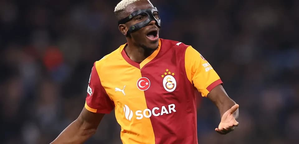 Player celebrating while wearing a protective mask