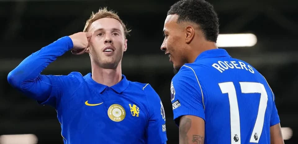 Two Chelsea players celebrating a goal together