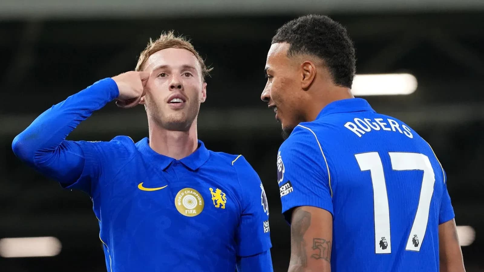 Two Chelsea players celebrating a goal together