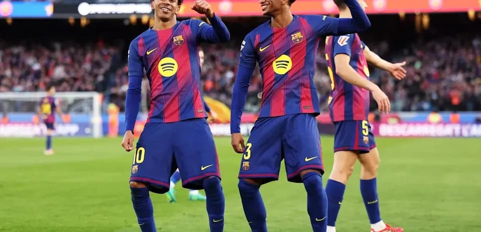Barcelona players celebrating a goal on the pitch
