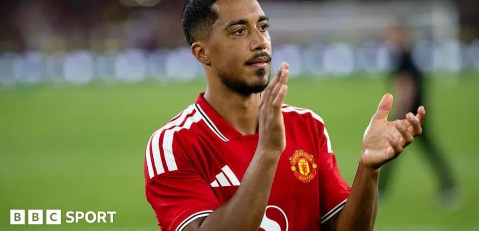 Player applauding fans in Manchester United jersey
