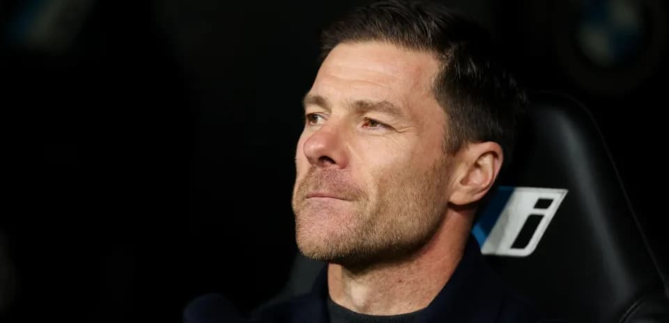 Coach sitting on bench during match