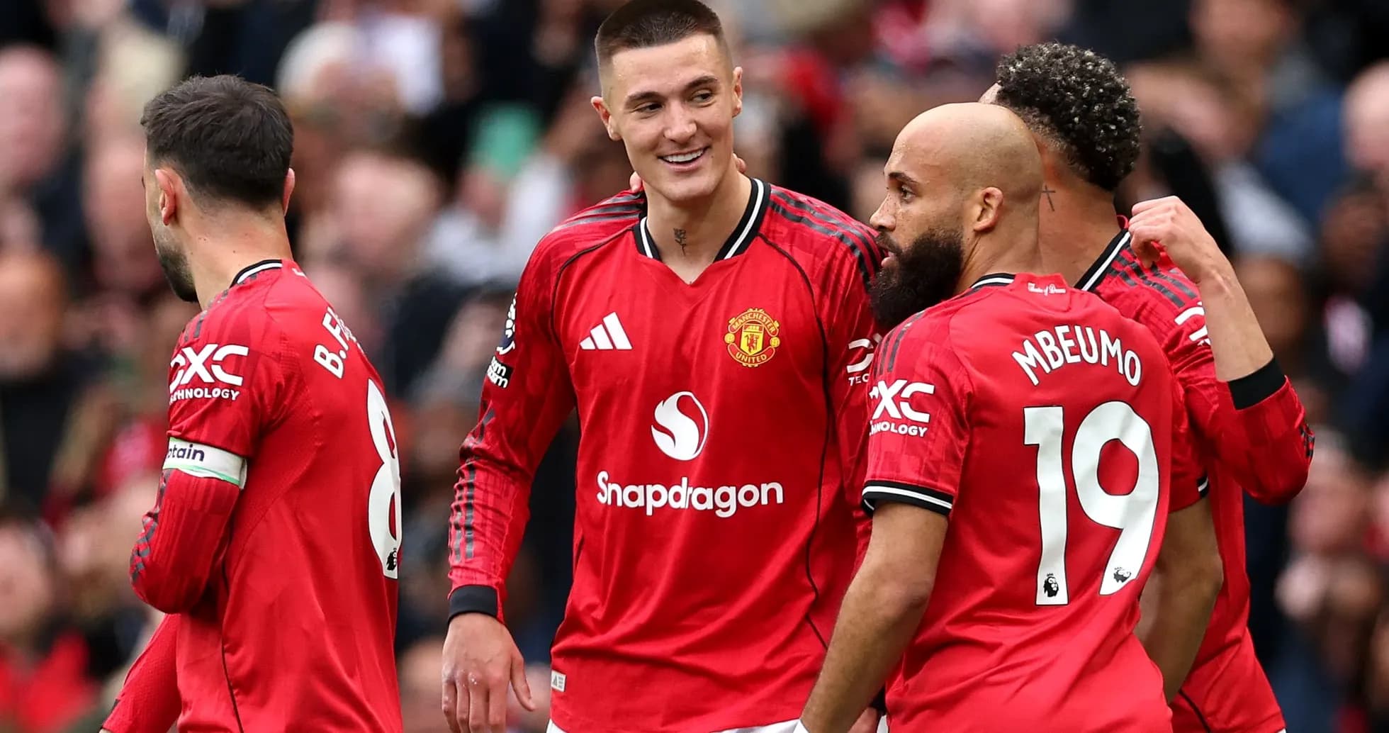 Manchester United players celebrating a goal together