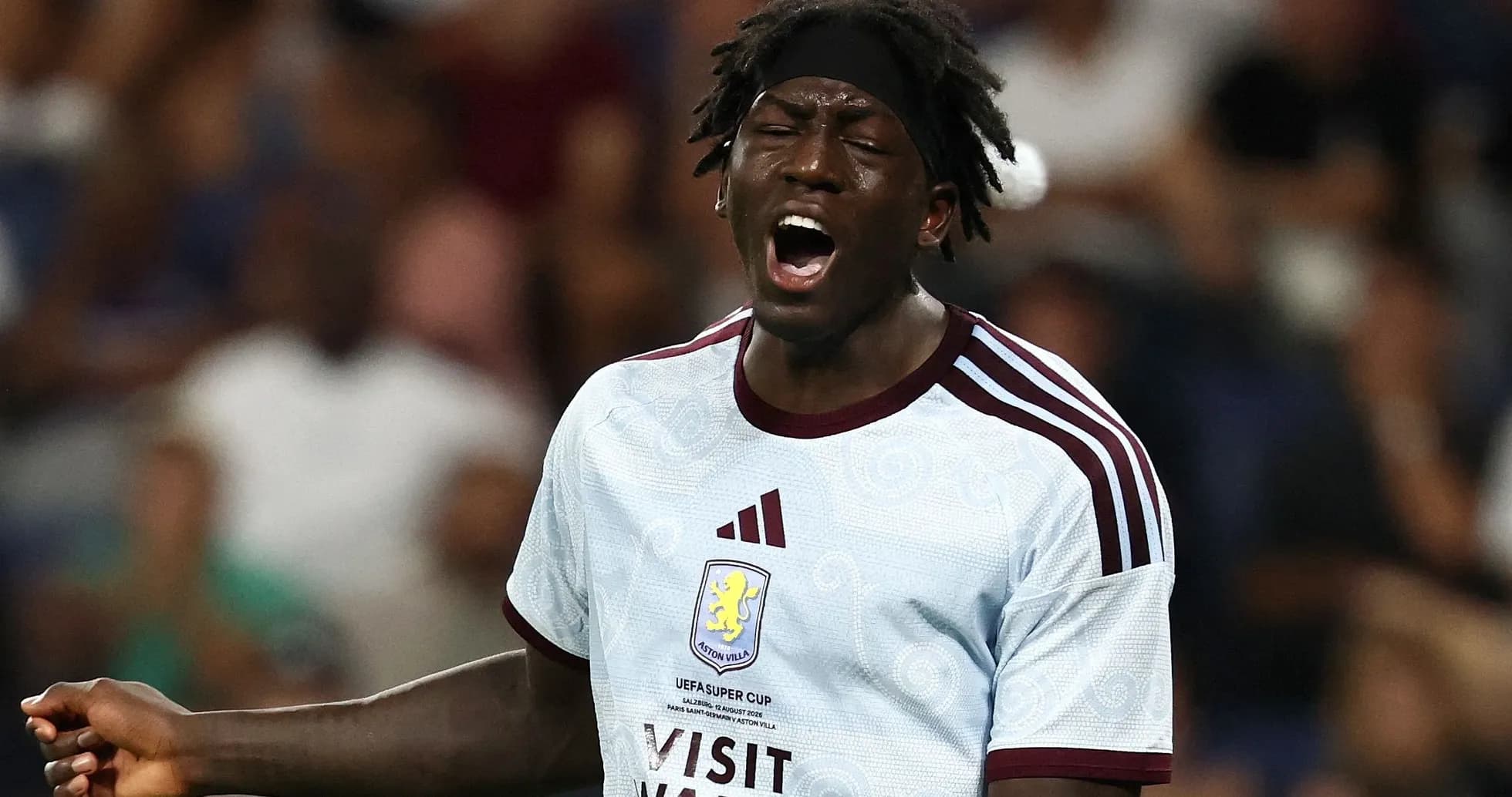 Player in Aston Villa kit celebrating during match