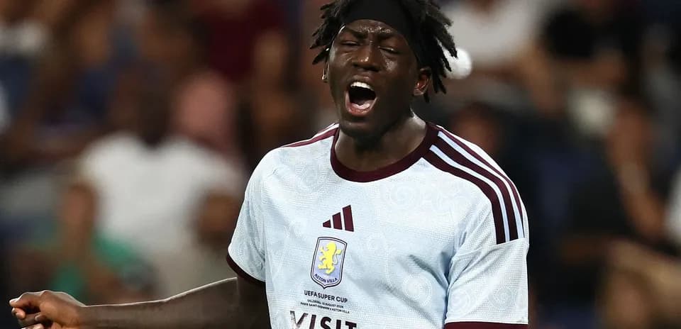 Player in Aston Villa kit celebrating during match