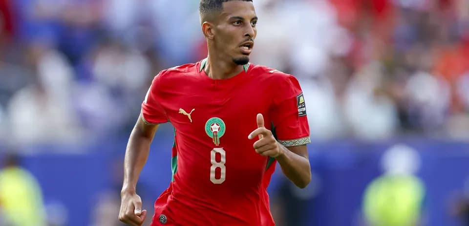 Moroccan player sprinting during a football match