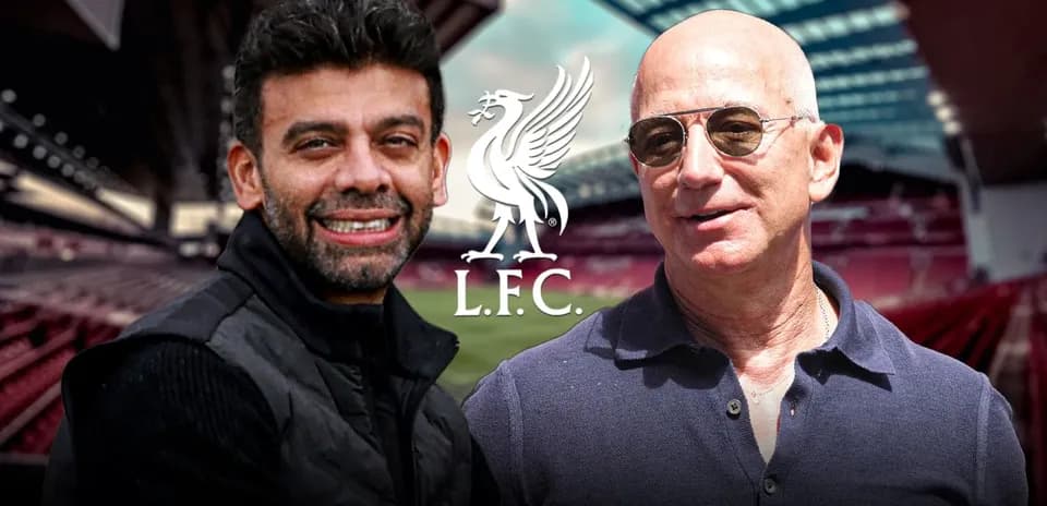 Two men smiling in front of football stadium