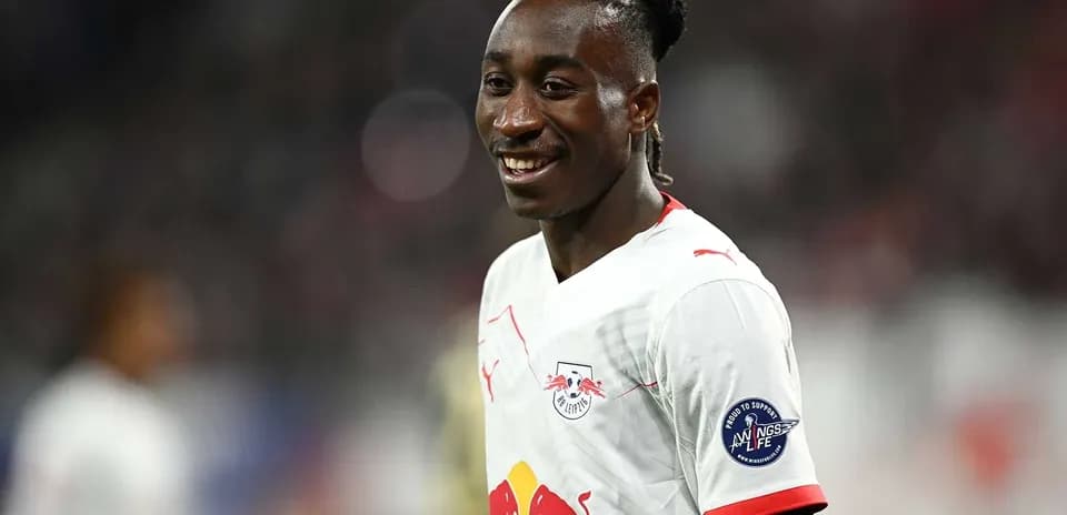 Player smiling in RB Leipzig jersey during match