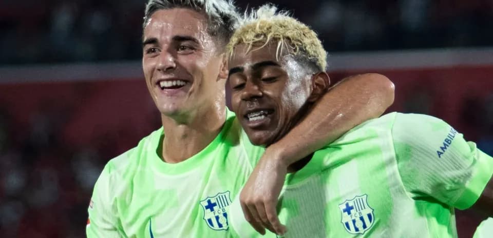 Two players celebrating together after scoring