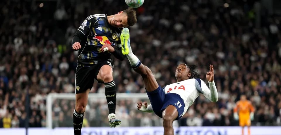 Goalkeeper and player colliding during a match