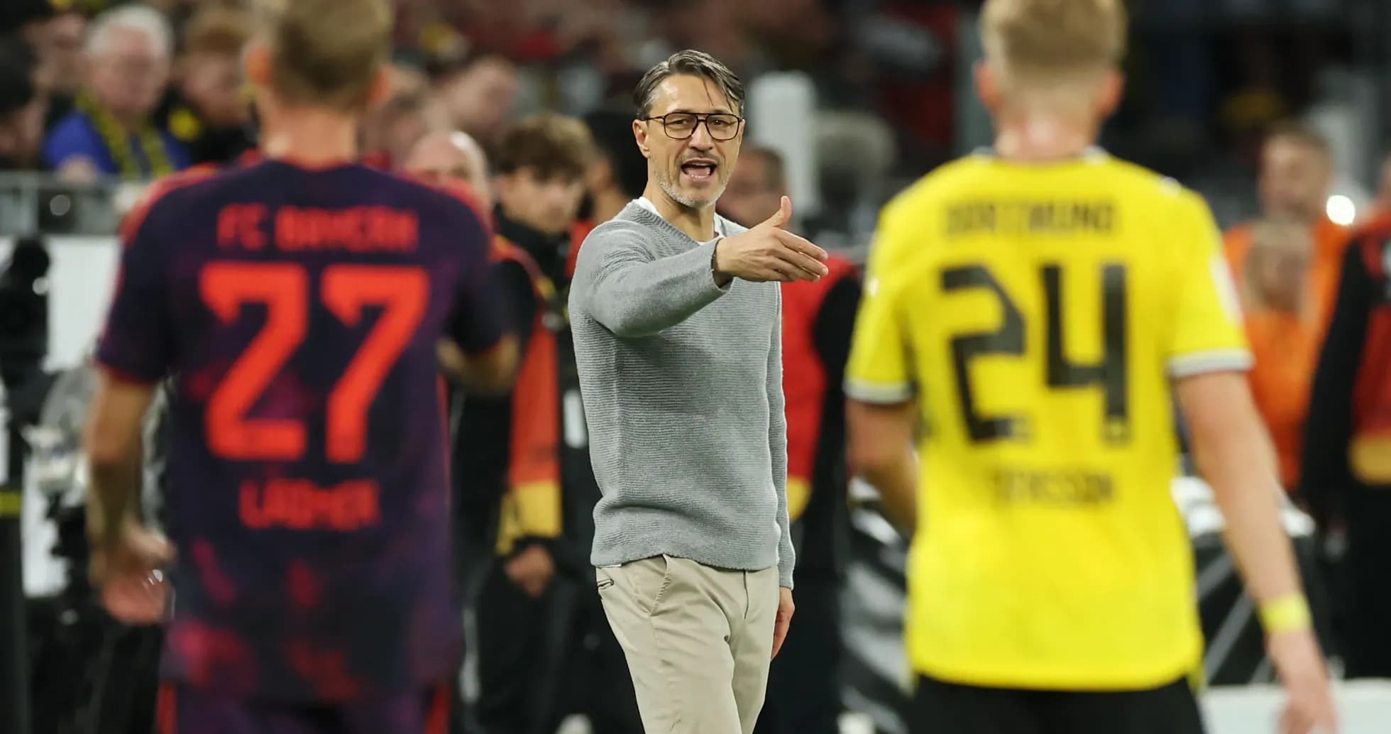 Coach instructing players during a match