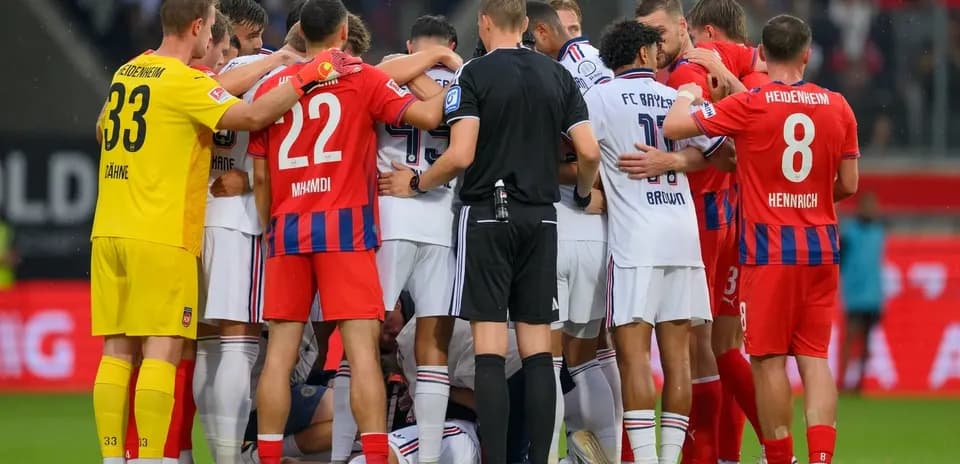 Players from both teams gathered around injured player