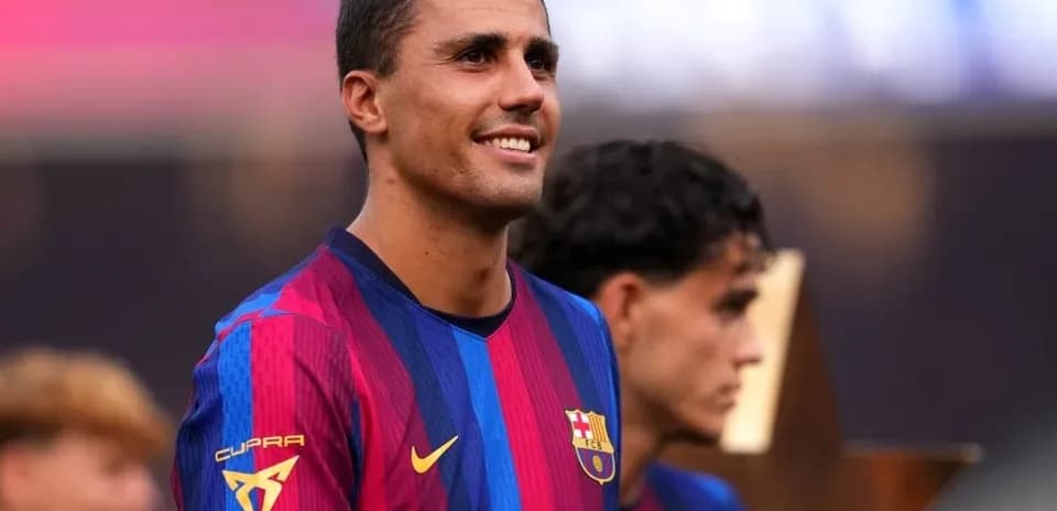 Barcelona player smiling during trophy presentation ceremony