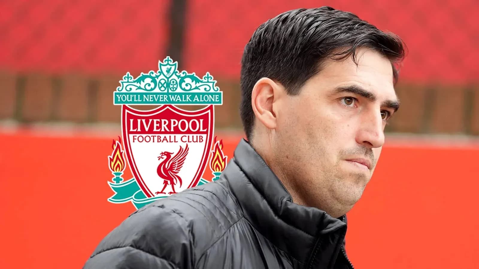 Coach standing near Liverpool FC logo