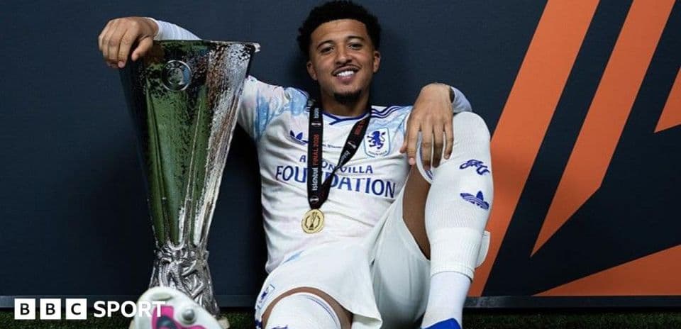 Player celebrating with trophy after winning tournament