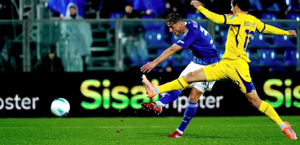Player striking the ball during Hellas Verona match