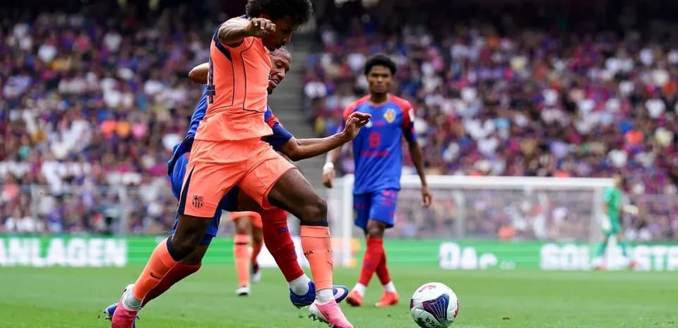 Player in orange battling for the ball during match