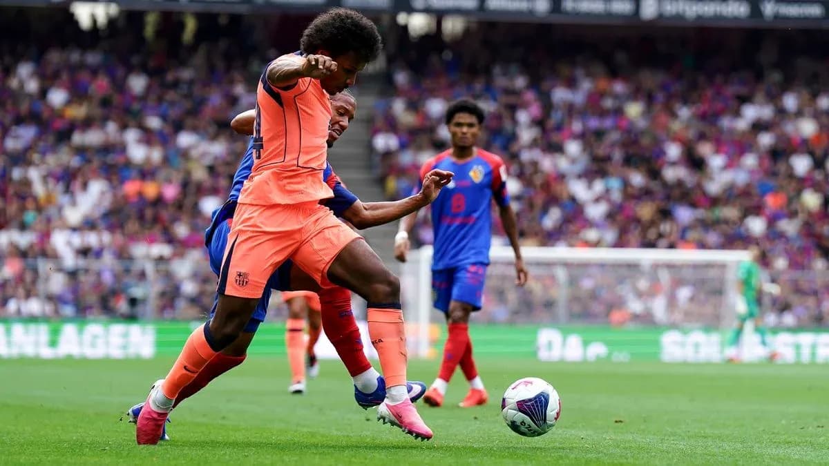 Player in orange battling for the ball during match