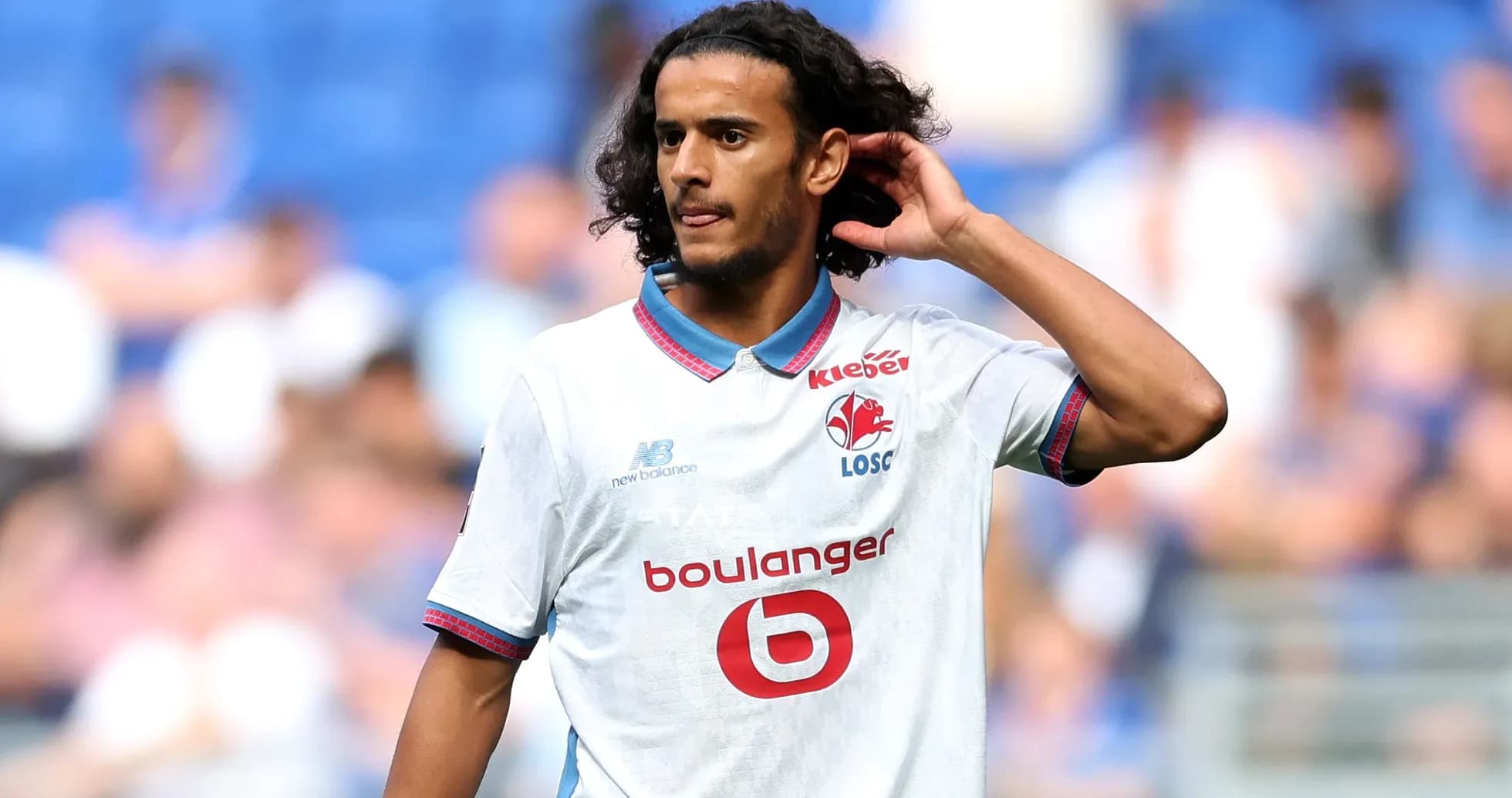 Player adjusting hair during match on field