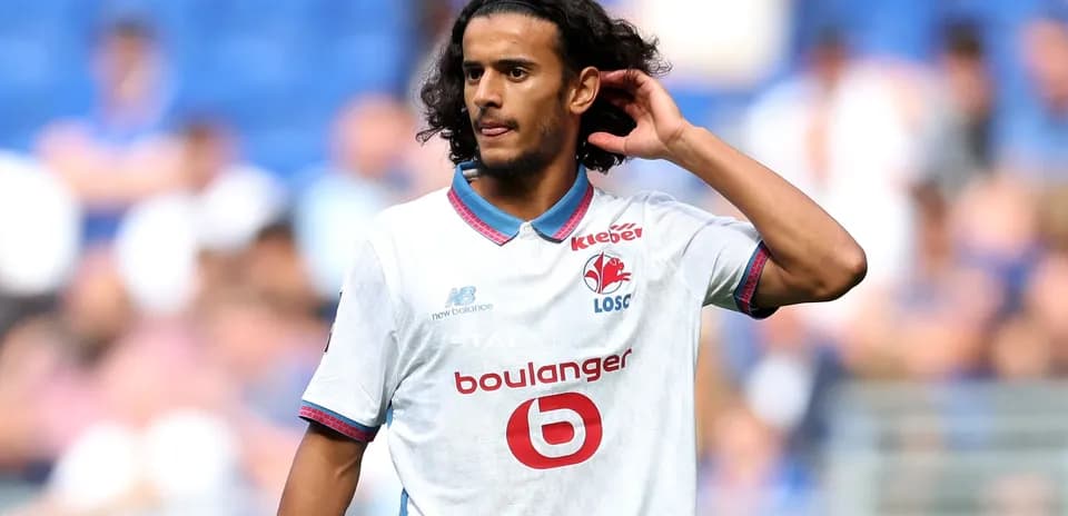 Player adjusting hair during match on field