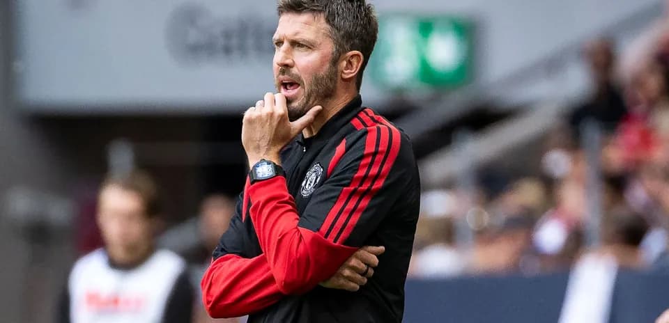Coach strategizing during a match on the sidelines