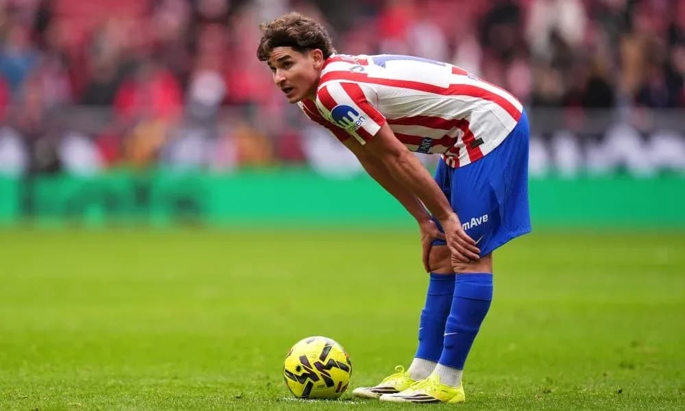 Player preparing to take a free kick on field