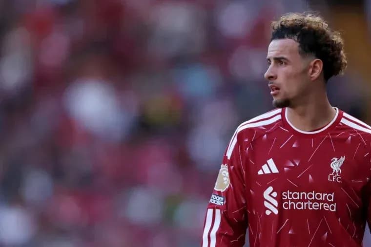 Player in Liverpool jersey on the pitch