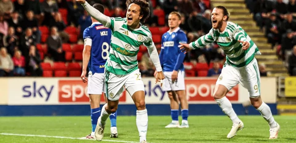 Celtic players celebrating a goal on the pitch