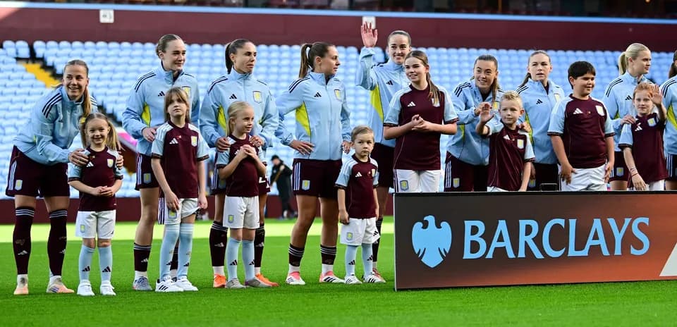 Aston Villa players with mascots before the match