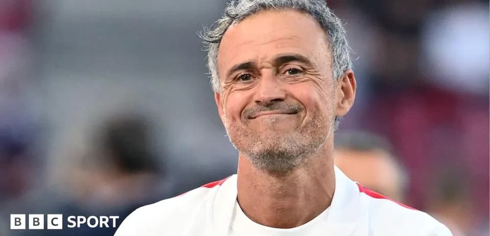 Coach smiling during match warm-up on field