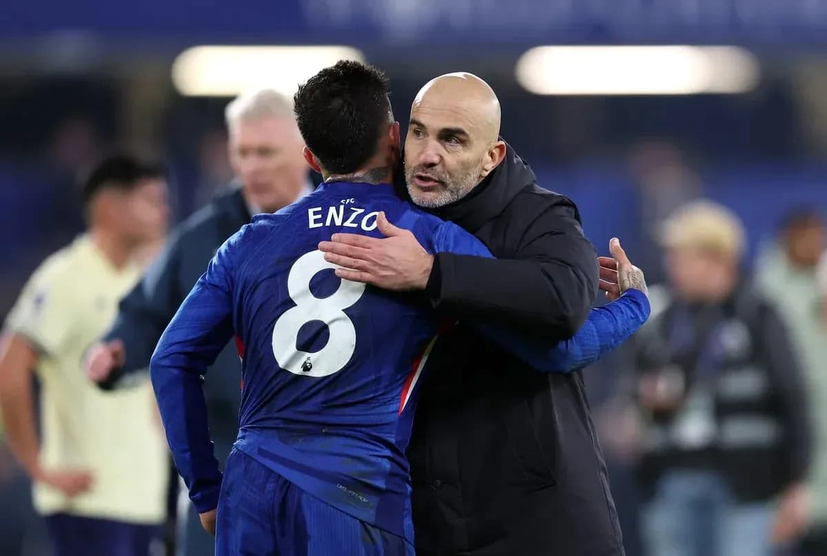 Coach embracing player Enzo after the match Coach embracing player Enzo after the match
