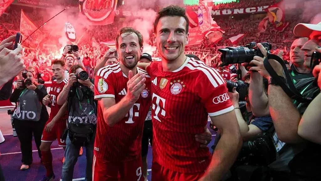 Bayern Munich players celebrating with fans after match Bayern Munich players celebrating with fans after match