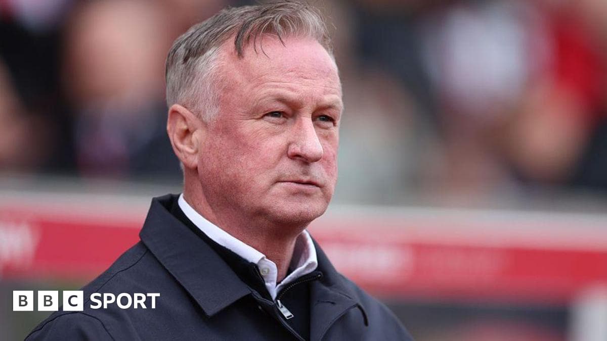 Manager observing the match from the sidelines Manager observing the match from the sidelines