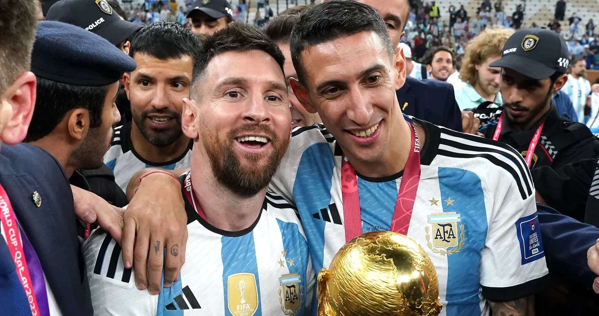Messi and Di Maria celebrating with FIFA World Cup trophy Messi and Di Maria celebrating with FIFA World Cup trophy