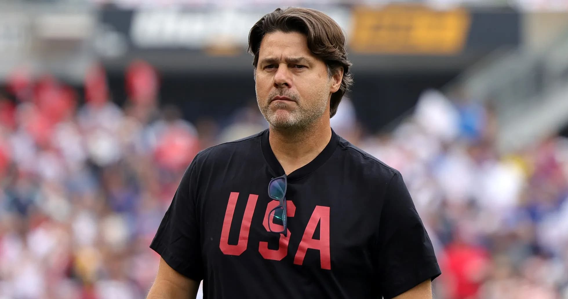 Coach wearing 'USA' shirt on the sidelines Coach wearing 'USA' shirt on the sidelines