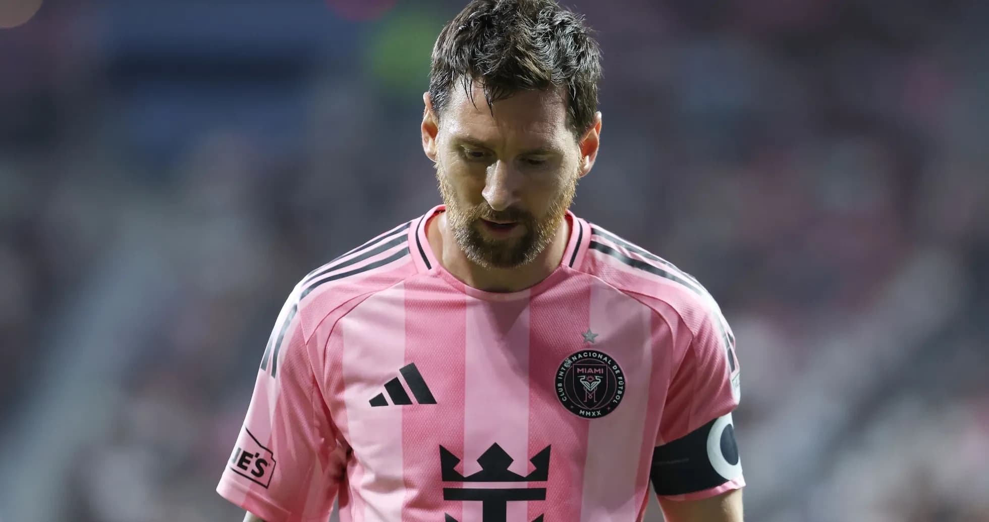 Player in pink jersey walking off the field Player in pink jersey walking off the field