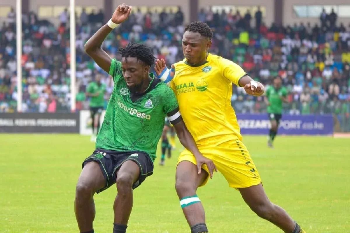 GOR Mahia player challenged by Nairobi United opponent GOR Mahia player challenged by Nairobi United opponent