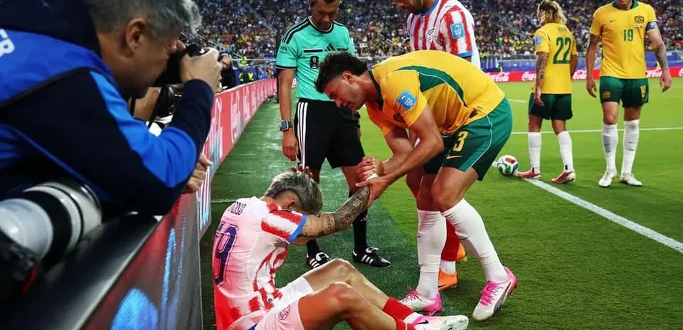 Player receiving assistance on the sidelines during match Player receiving assistance on the sidelines during match