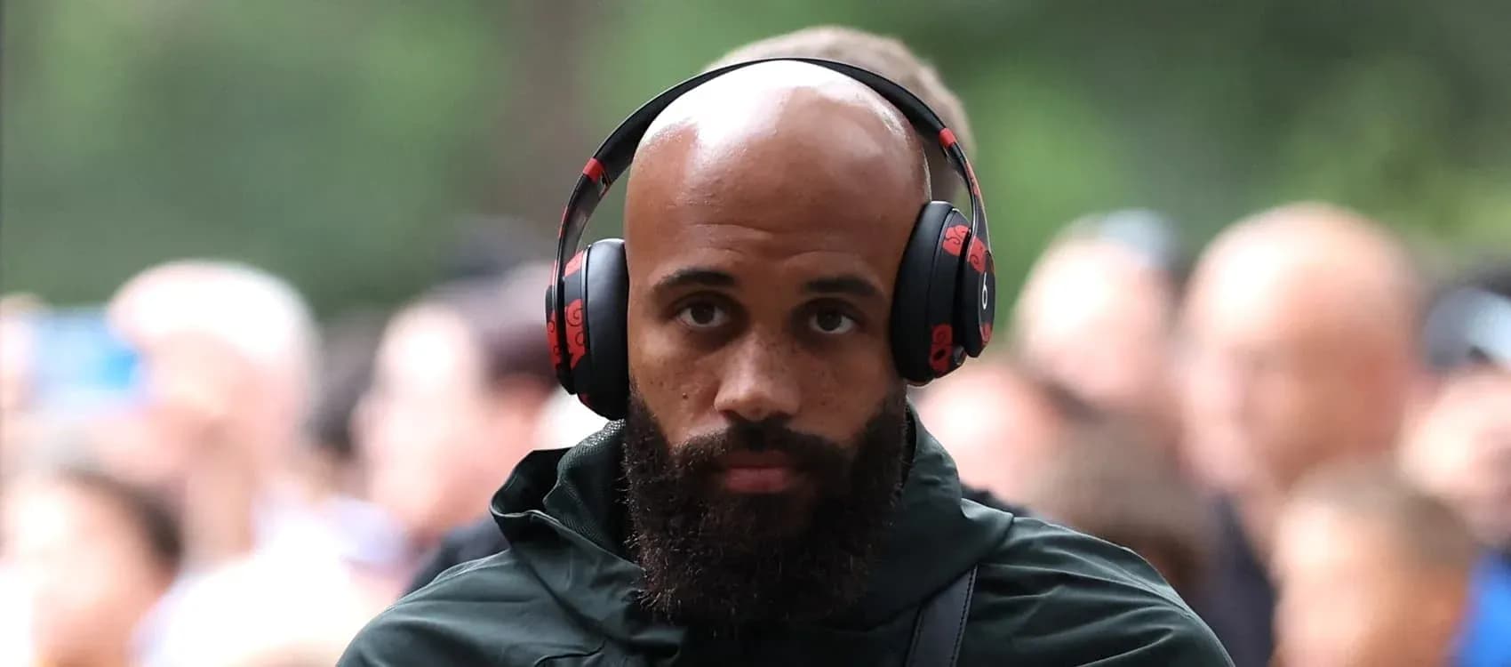 Player walking with headphones before match Player walking with headphones before match