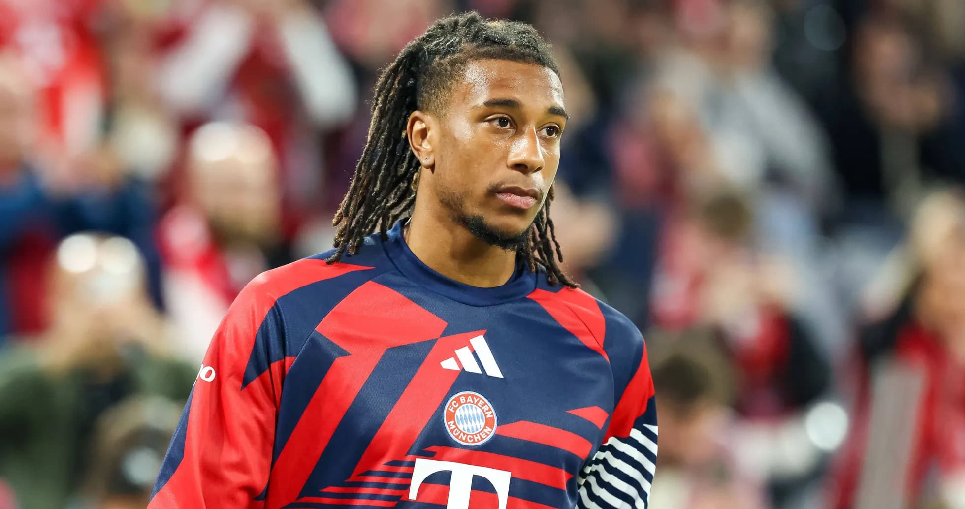 Player in Bayern Munich kit walking on field Player in Bayern Munich kit walking on field