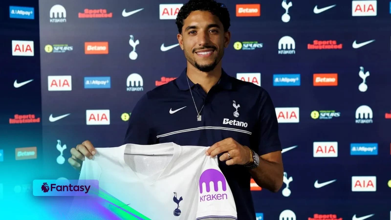 Player holding Tottenham Hotspur jersey at unveiling Player holding Tottenham Hotspur jersey at unveiling